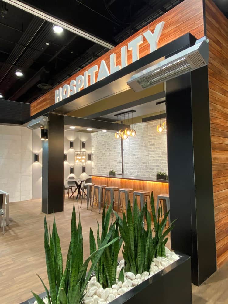 Open space hospitality business with electric heaters by aura heaters