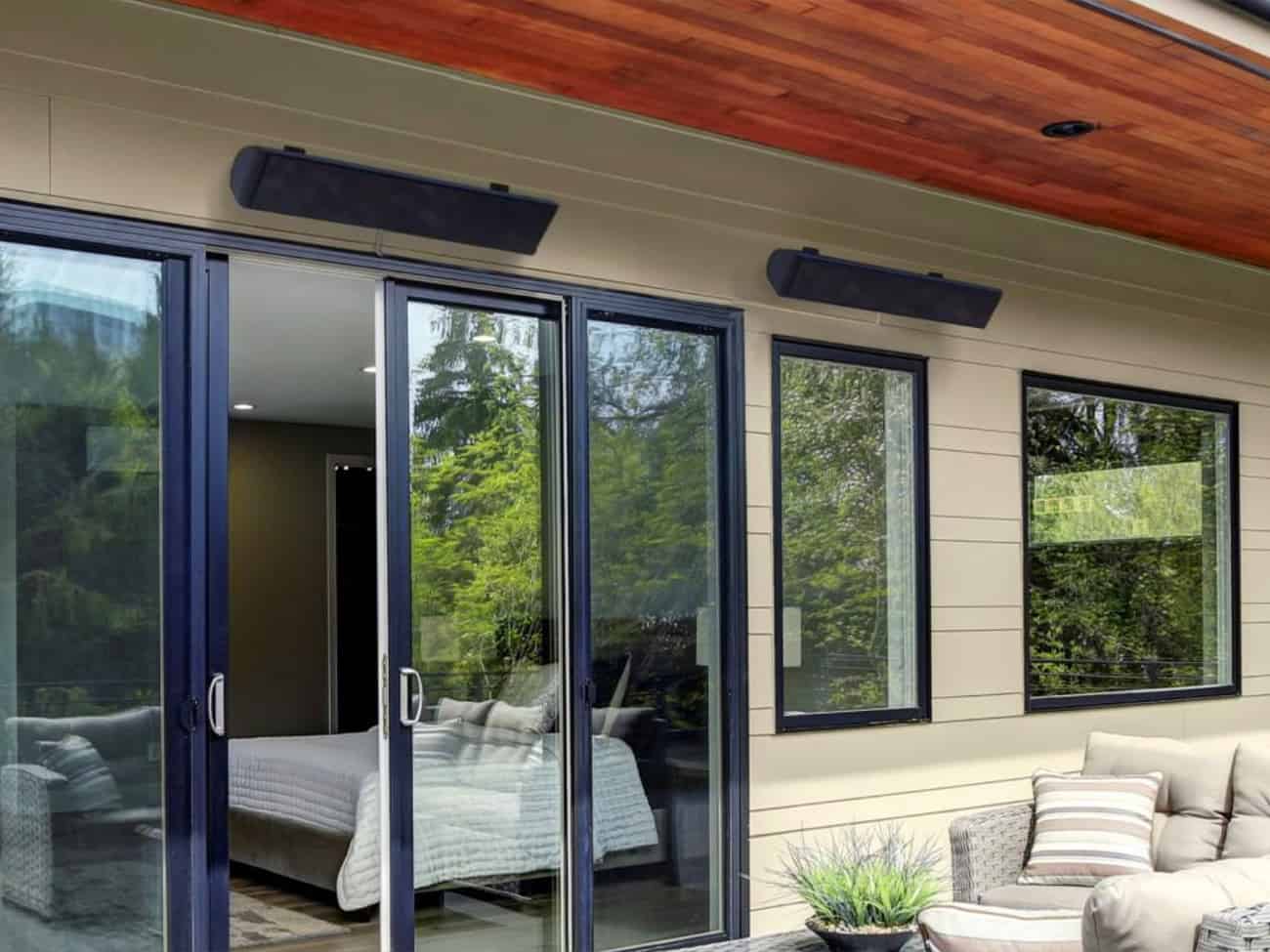 Outdoor patio with couch and two Ara Heaters | Aura Heater